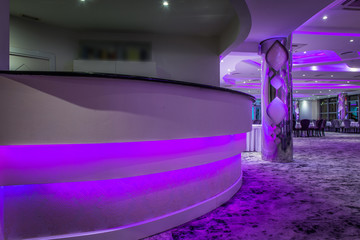 Bar in empty restaurant decorated with led lights