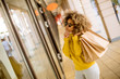 © BGStock72 - Young black woman with curly hair in shopping