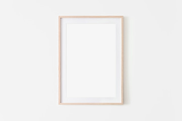 portrait large 50x70, 20x28, a3,a4, wooden frame mockup on white wall. poster mockup. clean, modern,
