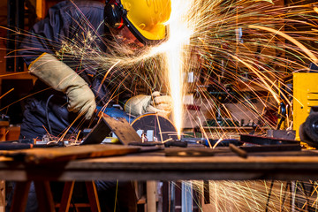 man with grinder in action