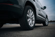 © Moose - Selective focus on blask SUV car rear wheel