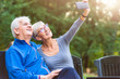 © lordn - Smiling senior couple in the park taking selfie