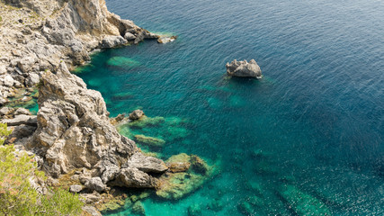 sea coast with green water