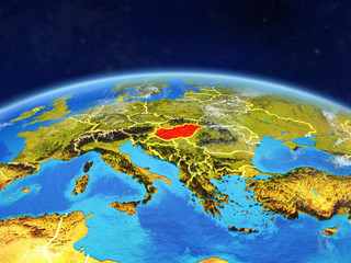 Wall Mural - Hungary on planet Earth with country borders and highly detailed planet surface and clouds.