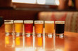 Tasting a variety of seasonal beers from a flight lined up on the table