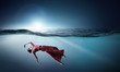 © Sergey Nivens - Woman dancer in clear blue water