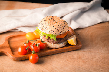 Hamburger homemade on wood table.