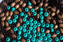Brown And Turquoise Wooden Beads Background. Handmade