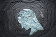 Leinwandbild Motiv Silhouette of depressed and anxiety person head. Negative emotion image. Person head shaped paper on black torn paper background.