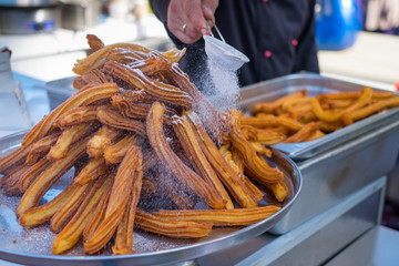 Delicious churros sticks deep fried and dusted with powdered sugar