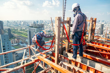 Construction Worker Wear Standard Personal Protective Equipment Dismantle Steel Structure At Height Rise Building Project