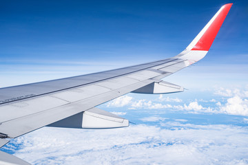 Beautiful view from airplane window and blue sky on nice sunny day, This time in altitude during flight.