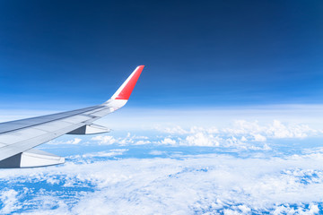 Wall Mural - Beautiful view from airplane window and blue sky on nice sunny day, This time in altitude during flight.