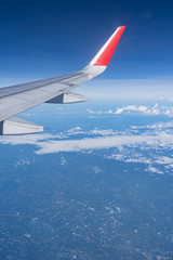 Wall Mural - Beautiful view from airplane window and blue sky on nice sunny day, This time in altitude during flight.