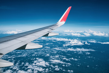 Wall Mural - Beautiful view from airplane window and blue sky on nice sunny day, This time in altitude during flight.