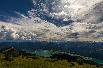 Wall Mural - Mountain landscape on the top of the hiking trail to the Schafberg and view of beautiful landscape over the Wolfgang see lake. Salzkammergut region near Salzburg, Schafberg, Austria.