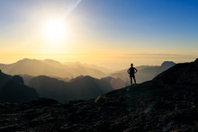 Woman Hiking Success Silhouette In Mountains Sunset