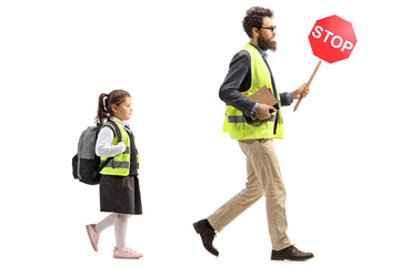 Sticker - Schoolgirl walking in a safety vest and a man holding a stop traffic sign