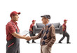 © Ljupco Smokovski - Senior man shaking hands with a mover, movers carrying a couch in the back