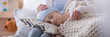 © Photographee.eu - Panorama of caregiver supporting sleeping sick child with cancer in the hospice