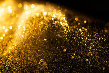 Wall Mural - glitter lights grunge background, gold glitter defocused abstract twinkly lights background.