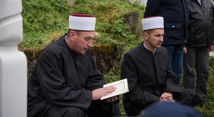 Wall Mural - quran holy book reading by imam  on islamic funeral