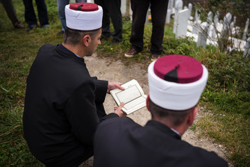 Wall Mural - quran holy book reading by imam  on islamic funeral