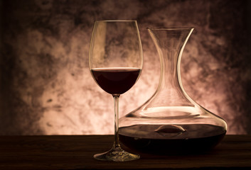 Wall Mural - Decanter with red wine and glass on table