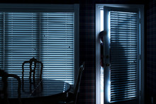 This Photo Illustrates A Home Break In At Night Through A Back Door From Inside The Residence.