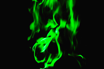 green flame on black background, background for placing text