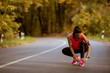 © BGStock72 - Young woman have a break during training in the autumn forest