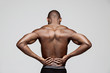 © master1305 - Young man with back pain isolated on gray studio