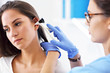 © Kalim - Adult woman having a visit at female laryngologist's office