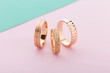 Stylish pink gold rings with different design on pink background