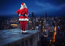 Santa Claus Looks Down On The City Waiting To Deliver The Presents