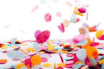 Wall Mural - Multicolored round confetti is flying to the table. Place for text. Festive concept.