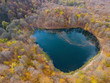 Drone flight over a hidden Gosh lake in the Armenian autumn forests