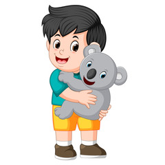 Sticker - a little boy holding koala