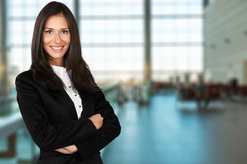 Portrait of a young  businesswoman  on background