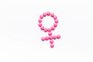 Wall Mural - Female diseases. Female gender icon symbol made of pills on white background top view copy space