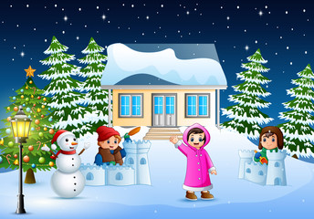 Wall Mural - Happy kids wearing a winter clotes playing a snow in the christmas day 