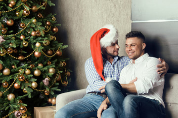 Two attractive guys, Christmas and happiness. 