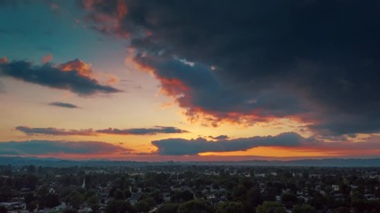Aufkleber - Aerial hyperlapse of beautiful dramatic cloudy sunset sky over San Fernando Valley cityscape. Los Angeles, California.