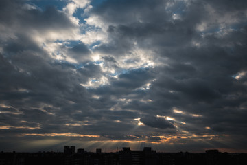 Wall Mural - Sun shining through thick cloudy sky, silver lining