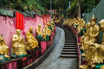 Golden Buddha statues along the stairs leading to the Ten Thousand Buddhas Monastery (Man Fat Tsz), Hong Kong, Sha Tin, New Territories