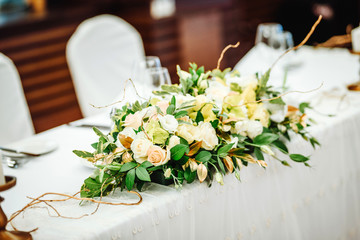 Wedding table set up. Indoor set up of a wedding/party table with  flower decoration