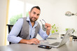 © W PRODUCTION - portrait of handsome trendy casual mid age business man in office desk with laptop computer