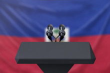 Podium Lectern With Two Microphones And Haiti Flag In Background