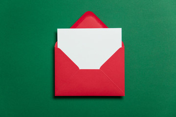 Blank white card with red paper envelope Christmas card template mock up.