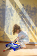 © sharafmaksumov - Little kid girl helping making renovation at house room.